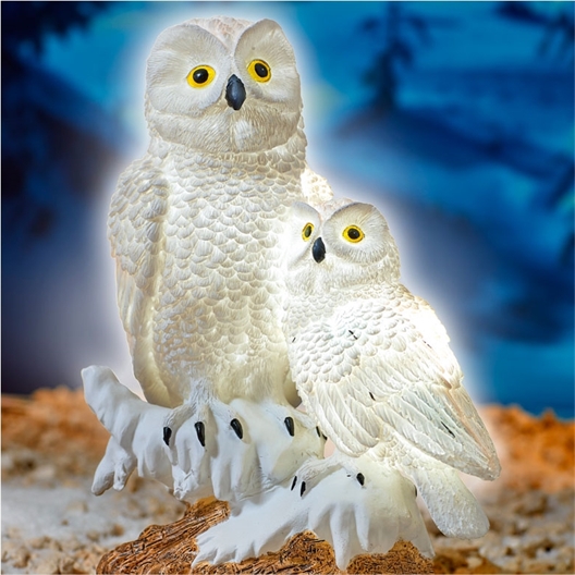 2 solar powered snowy owls